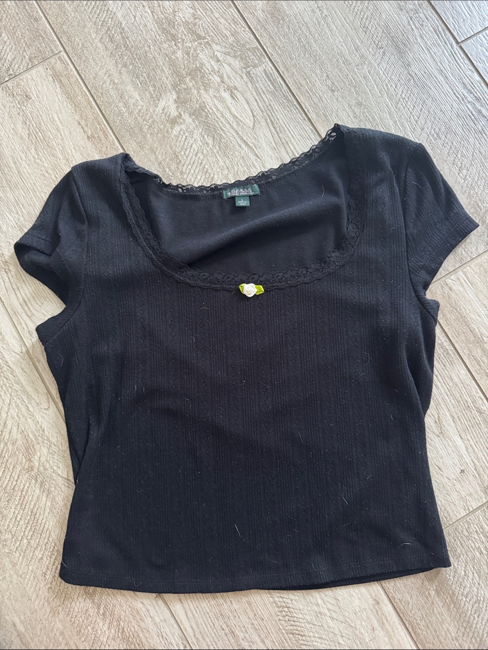 Black top with flower in middle